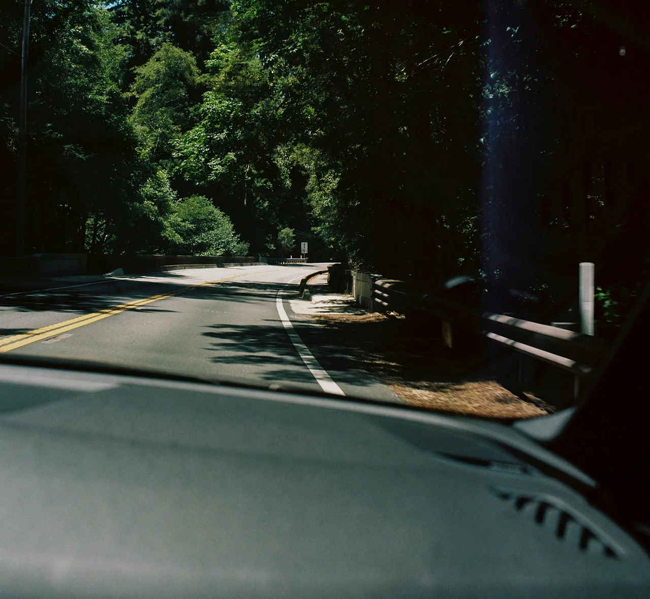 Image through dashboard of the open highway